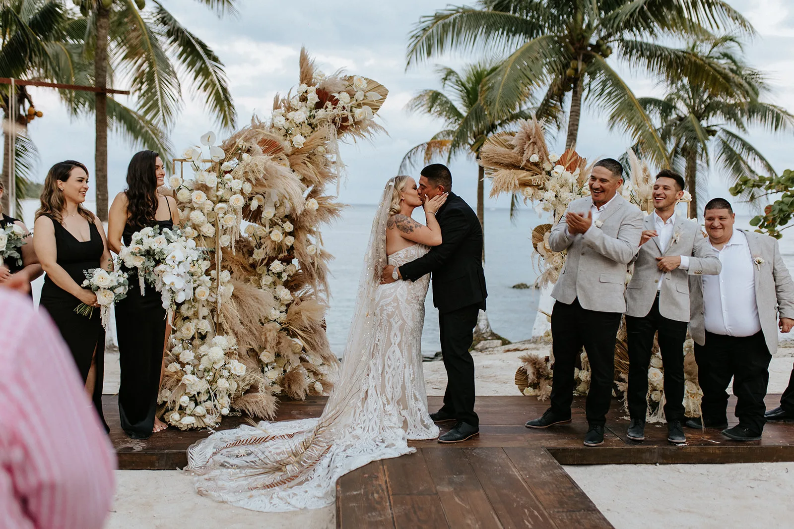 Boho beachfront ceremony arch with pampas — Blue Venado Paamul